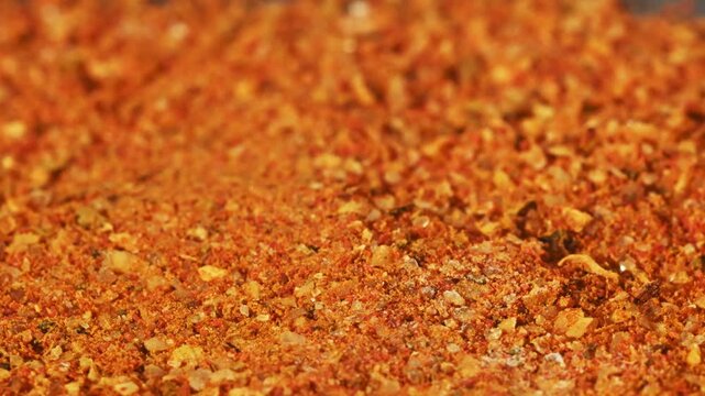 Close-up macro vibrant spice mix with orange tones