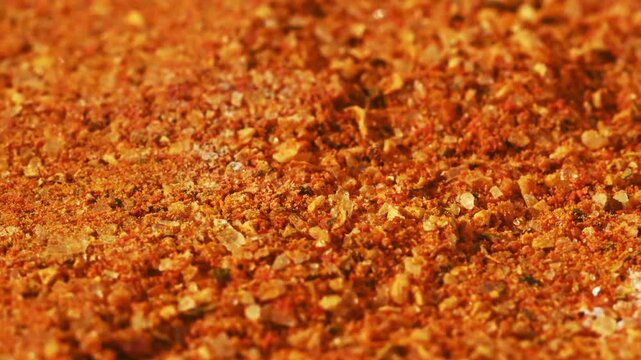 Close-up macro vibrant spice mix with orange tones