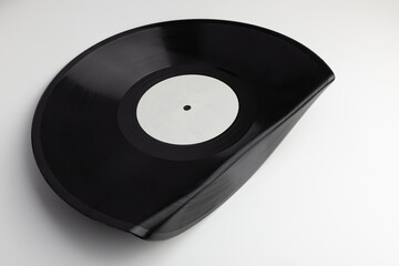 Fototapeta premium Black Vinyl Record With Curled Edge on a white background