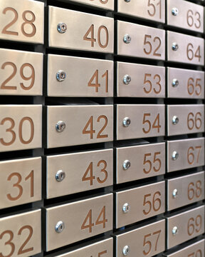 Metallic postal mailboxes with numbered faces