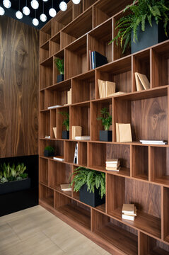 Modern wooden bookshelf with plants and books