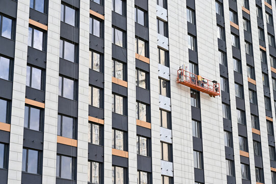 Construction worker on a suspended platform