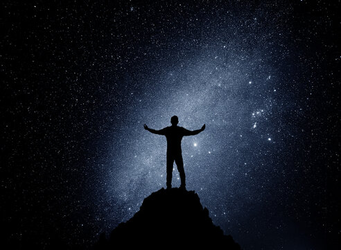 Human silhouette on a starry night under the universe