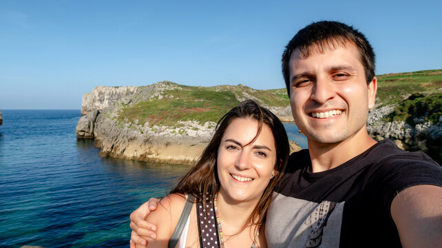 Couple enjoying the view at Playa de Cue