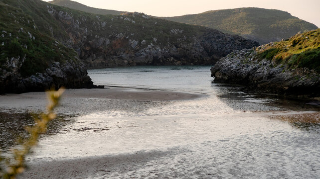 Serene shores of Poo beach in Llanes at sunset