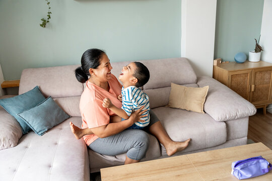 Joyful moment between mother and son at home