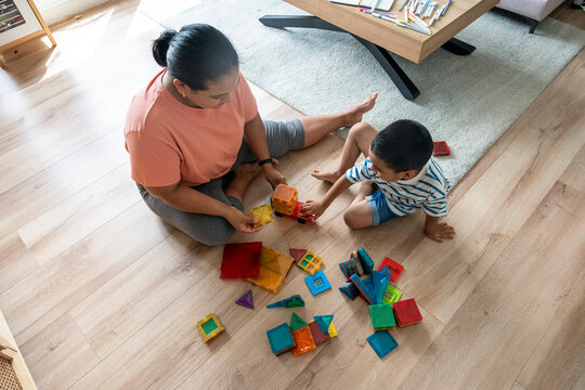 Mother and son playing with colorful toys