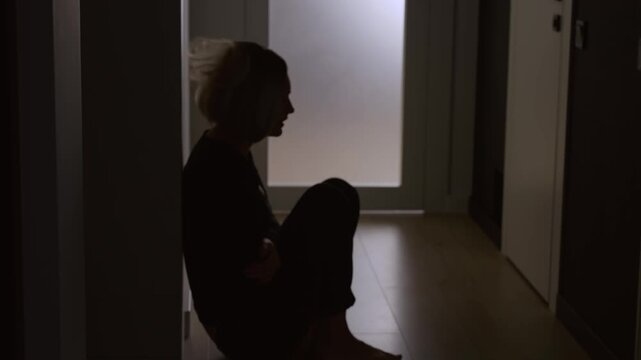 Black silhouette upset unhappy woman cries after quarrel scandal in dark room, mood anxiety depression emotion. Sad lonely desperate girl cry sob feels bad panic attack stress, suffers pain hurt abuse