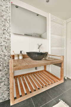 Modern wooden bathroom vanity with black bowl sink