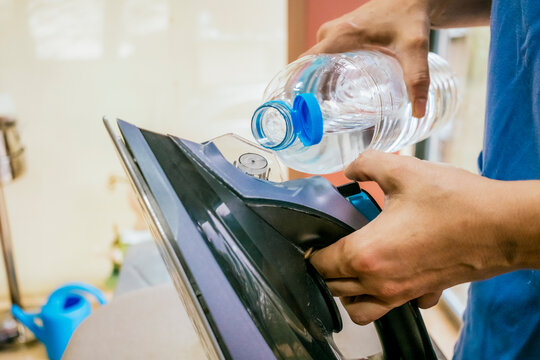 Refilling water in a steam iron with a plastic bottle
