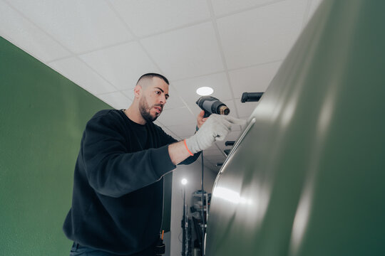 Vehicle customization by professional technician in workshop