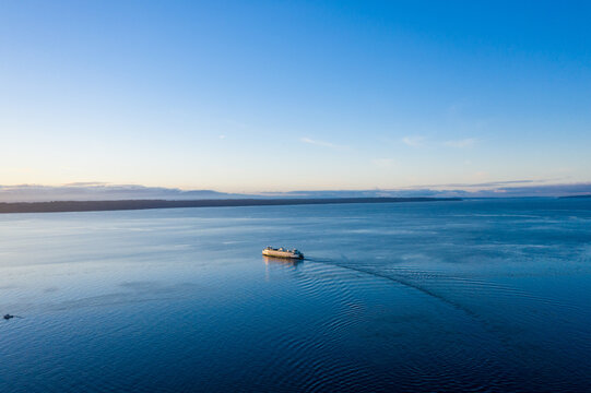 Kayaker on Calm Puget Sound at Sunset Aerial View
