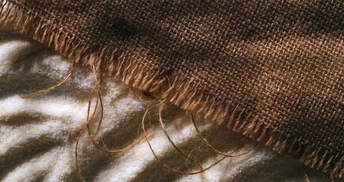 Slow Motion of Rustic Burlap Fabric Texture Close Up. Natural Linen Textile Background Concept Of Craft And Sustainability