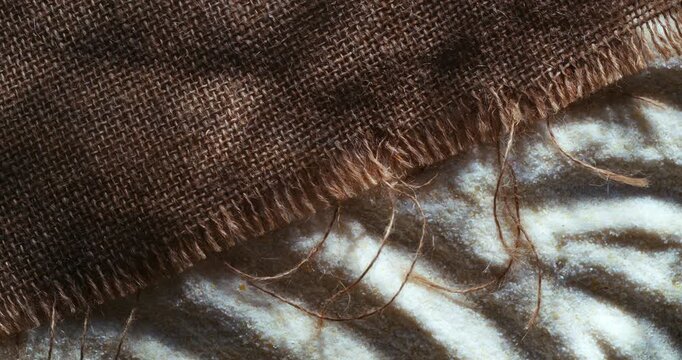 Slow Motion of Rustic Burlap Fabric Texture Close Up. Natural Linen Textile Background Concept Of Craft And Sustainability