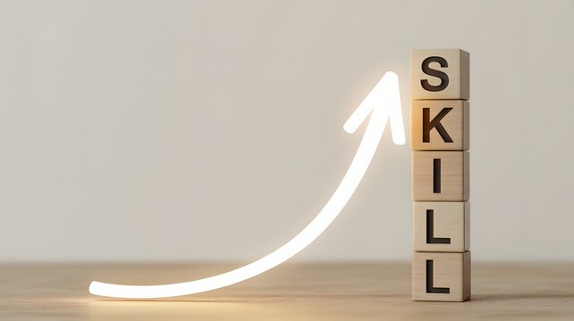 Stack of wooden cubes spelling SKIL with upward arrow graphic skill ability