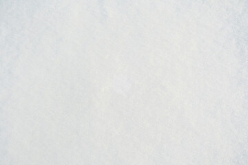 Close up view of clean fresh white snow surface displaying a delicate sparkling winter texture