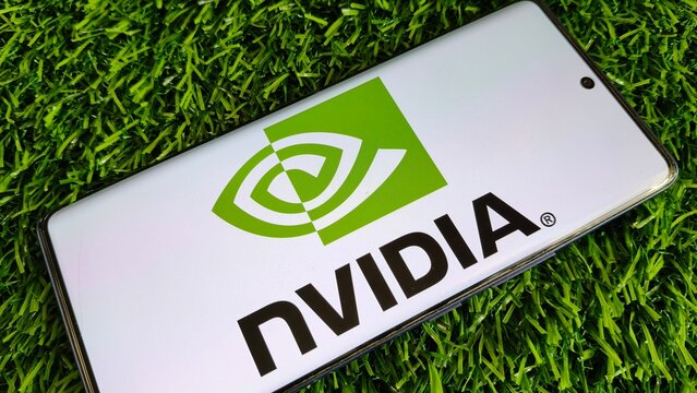 NVIDIA logo on modern smartphone on green grass background
