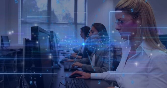 Three women typing in training, HUD overlay passing between screens and causing camera pan right