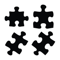 Obraz premium Four distinct black silhouette puzzle pieces isolated on a clean white background