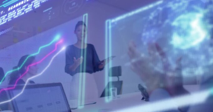 Presenter tapping tablet, presenting business data and animating AR globe while team clapping