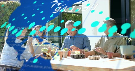 Potting four hobby gardeners wearing casual clothes around wooden table on patio with blue overlay © vectorfusionart