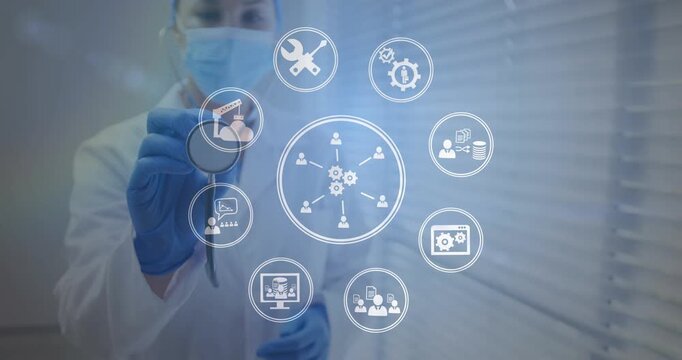 Doctor holding stethoscope starting gear icon sending nodes HUD forming ring mapping healthcare