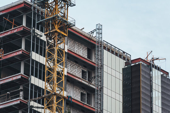 High rise urban development under construction with industrial scaffolding and structural framework