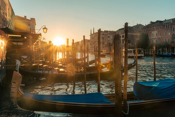 Golden sunset over Venice grand canal with traditional gondolas and waterfront classic building © Mumemories