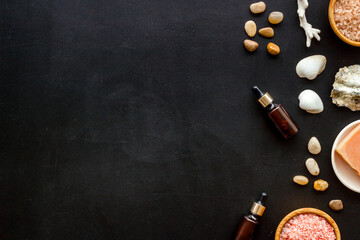 Set of body care cosmetics products with essential oil scrubs and sea salt, top view. Aromatherapy spa products