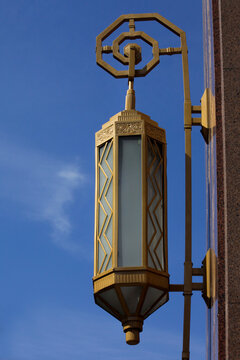 Havana, Cuba. Brass art deco lamp on exterior of a building