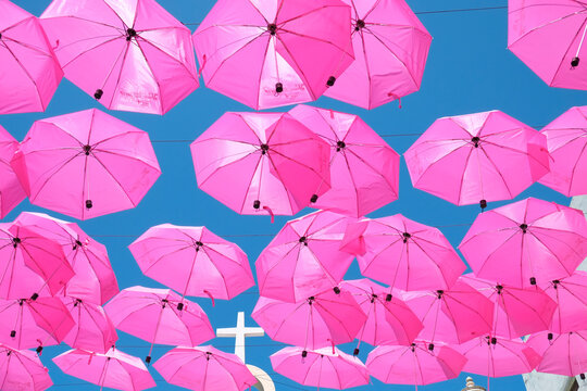 San Juan, Puerto Rico.  Pink umbrellas and sky in old San Juan Puerto Rico 