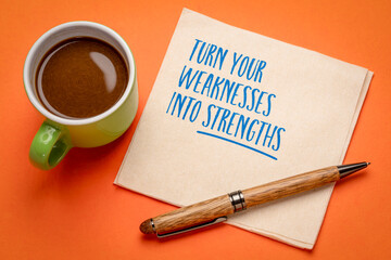 Turn your weaknesses into strengths. Inspirational reminder note on a napkin.