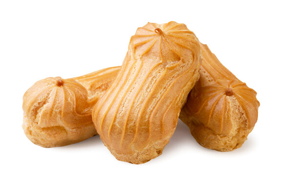 Pile of mini eclairs close-up on a white background. Isolated