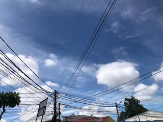 Fototapeta premium high voltage power lines against blue sky