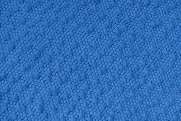 Blue jacquard upholstery fabric with raised fluffy pom pom pattern, weave creating rich textured cloth surface. Decorative textile background for furniture, interior design, upholstery backdrop