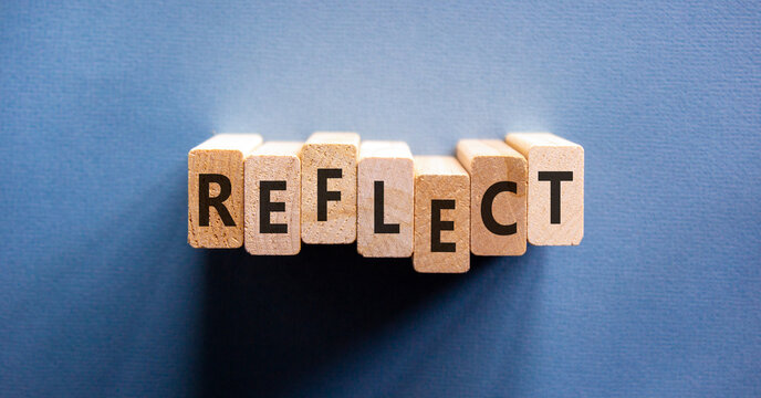 Reflect word symbol. Concept word Reflect on beautiful wooden blocks. Beautiful blue background. Business psychological reflect word concept. Copy space.