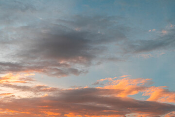Beautiful colorful sunset with orange clouds. Sky background.