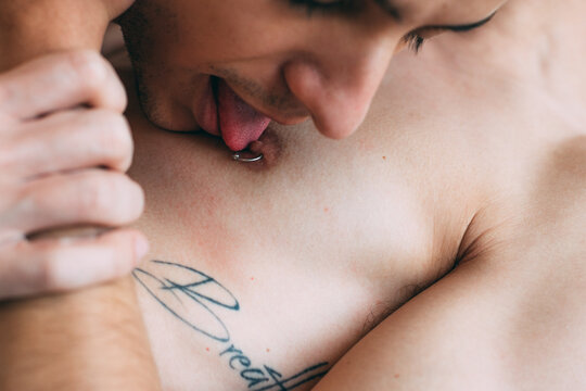 Intimate Close Up of Male Chest and Nipple With Piercing