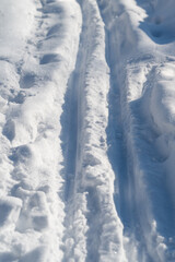 Obraz premium Snowy trails showcase natural harmony. Beautiful snowy terrain with peaceful and balanced vibe. Immaculate snowcovered paths evoke health and tranquil outdoor living