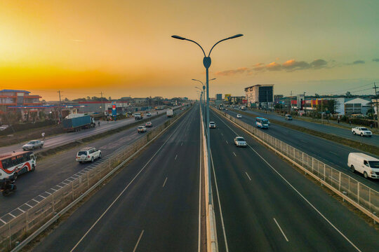 Sunset Over Mombasa Road Highway in Syokimau, Kenya &ndash; Urban African Road at Golden Hour