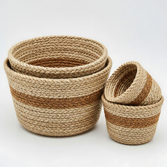 Obraz premium Set of woven baskets in natural fiber with earthy tones