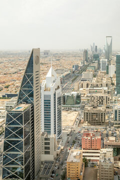 Contemporary cityscape with futuristic high rise architecture, corporate towers and dense urban downtown development representing economic wealth, Al Olaya, Riyadh, Saudi Arabia