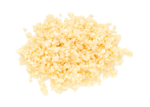 Pile of chopped garlic isolated on white, top view