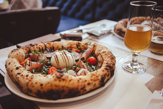 Rich Italian pizza on the restaurant table