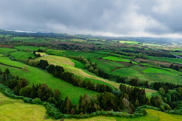 Lush green landscape with pastureland on volcanic Sao Miguel Island Azores in Atlantic Ocean. Aerial view
