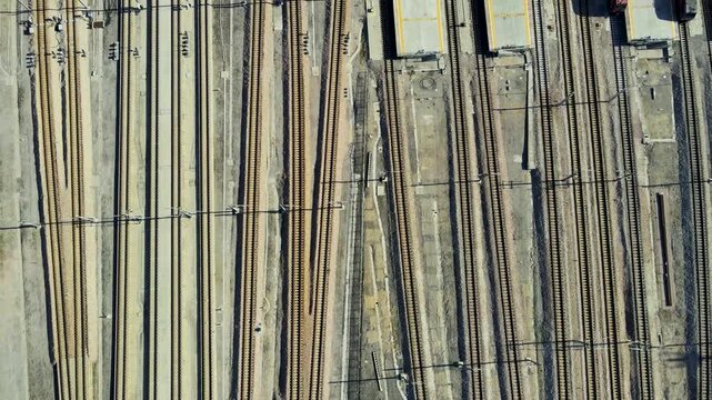 Aerial View of Railroad Yard with Multiple Parallel Train Tracks