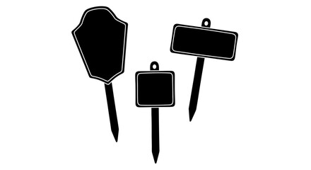 Collection of black signboards with various shapes on stakes, standing upright on a white background, viewed from the front © John