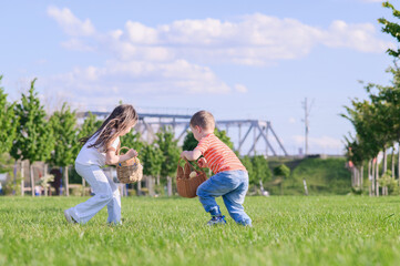 Kids Hunting Easter Eggs Outdoors on Sunny Spring Day