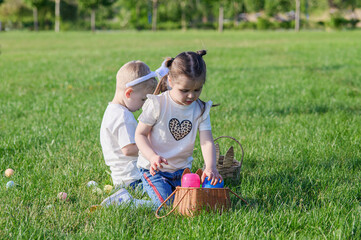 Kids Hunting Easter Eggs Outdoors on Sunny Spring Day
