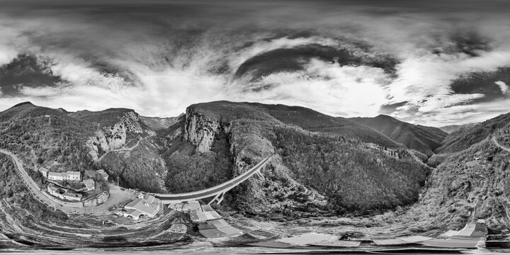 Drone shot of bridge between mountains near Triora with seamless 360 degree panorama